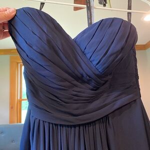 Long, navy blue dress. Heart shaped chest line. Comfortable, breathes.
